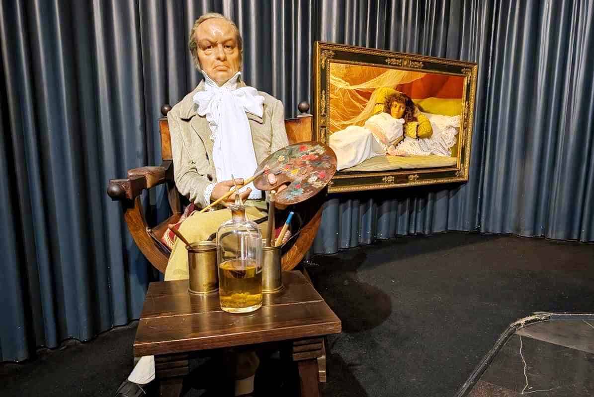 Figura de Goya pintando a una maja